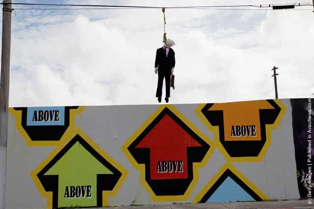 Effigy Of Wall Street Banker Hangs By Freeway In Miami