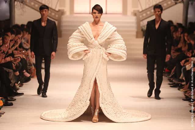 A model showcases The Bride by Stephane Rolland on the catwalk as part of Women's Fashion Week Haute Couture