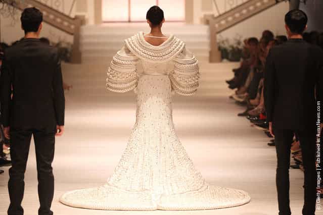A model showcases The Bride by Stephane Rolland on the catwalk as part of Women's Fashion Week Haute Couture