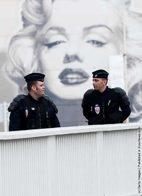 Police officers patrol a bridge ahead of the G20 Summit