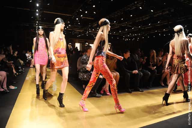 Models walk the runway at the Versace for H&M Fashion event at the H&M on the Hudson