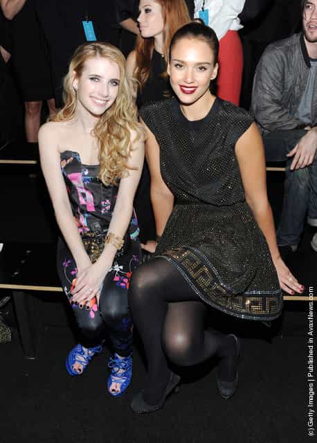 Actresses Emma Roberts and Jessica Alba attend the Versace for H&M Fashion event