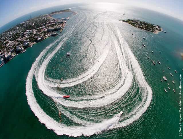Offshore powerboats make the turn in Key West Harbor during the first of three race days at the Key West World Championship