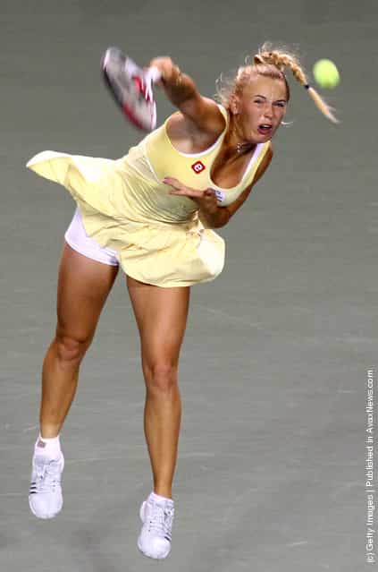 Caroline Wozniacki of Denmark serves in her match against Kaia Kanepi of Estonia