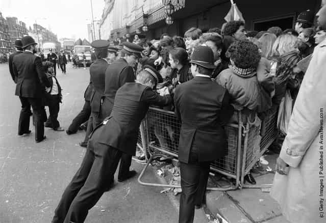 Police controlling a crowd of Michael Jackson fans outside Madame Tussauds wax museum, London, 3rd March 1985