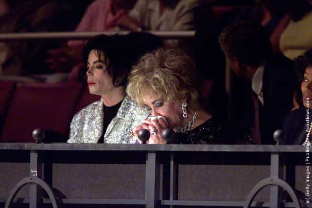 Music star Michael Jackson sits with actress and close friend Liz Taylor at the 30th anniversary celebrations held on September 10, 2001 at Madison Square Gardens, in New York