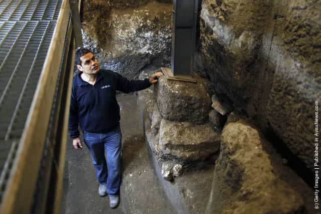 Israeli Archaeologist Eli Shukron of the Israel Antiquities Authority speaks inside a ritual bath exposed beneath the Western Wall in Jerusalems Old City, Israel