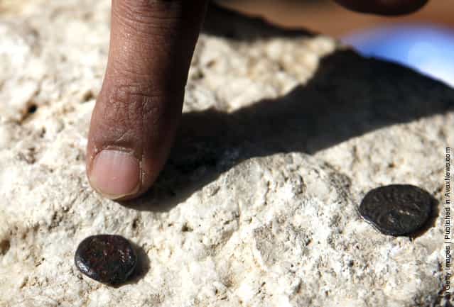 Two ancient bronze coins, which according to Israel Antiquities Authority archaeologists were struck by the Roman procurator of Judea, Valerius Gratus, in the year 17/18 CE and recently were revealed in excavations beneath the Western Wall in Jerusalems Old City