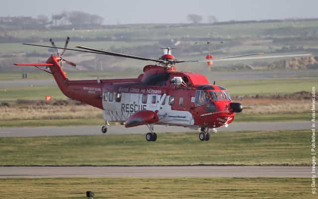 An Irish Coastguard Rescue helicopter leaves RAF Valley as the search continues for the crew of cargo vessel The Swanland which sank off north Wales on November 27, 2011 in Anglesey, Wales