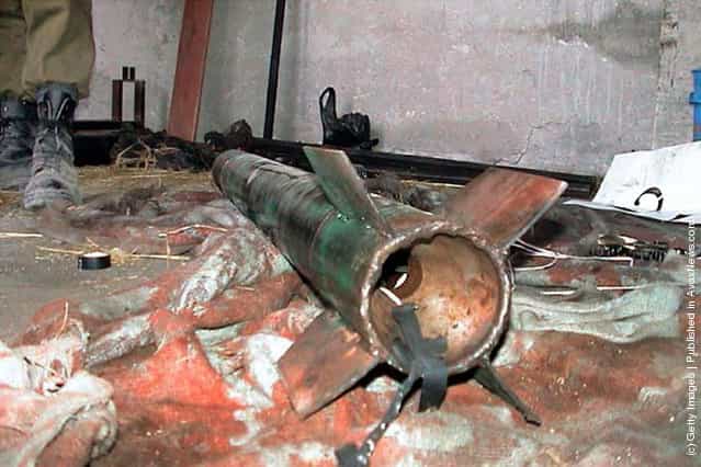 A Palestinian Qassam rocket lies on the floor of a weapons factory discovered by the Israeli army