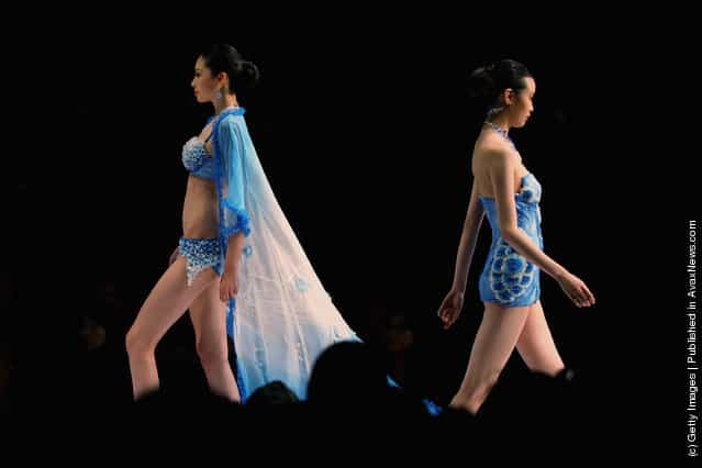A model showcases designs on the catwalk during the Ordifen Cup China Lingerie Design Contest 2011 of China Fashion Week