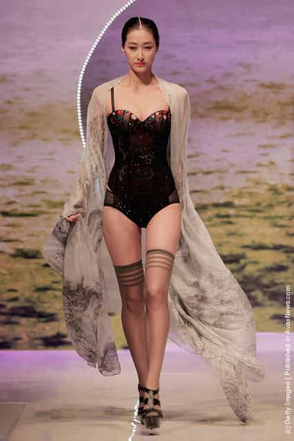 A model showcases designs on the catwalk during the Ordifen Cup China Lingerie Design Contest 2011 of China Fashion Week