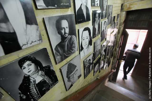Portraits of famous Iraqis are seen in the stairwell of a bookshop