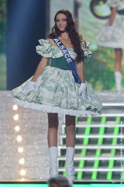 Miss Alsace, Delphine Wespiser walks along the stage during Miss France 2012 Beauty Pageant