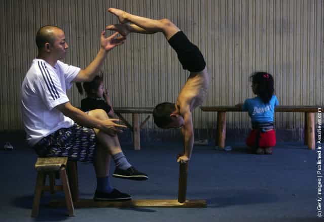 Students practice acrobatic skills in the Sichuan Provincial Art School in Chengdu of Sichuan Province, China