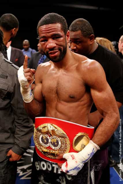 Lamont Peterson celebrates with the belt after defeating Amir Khan during the Capital Showdown: Khan v Peterson WBA/IBF World light-welterweight title bout at Washington Convention Center