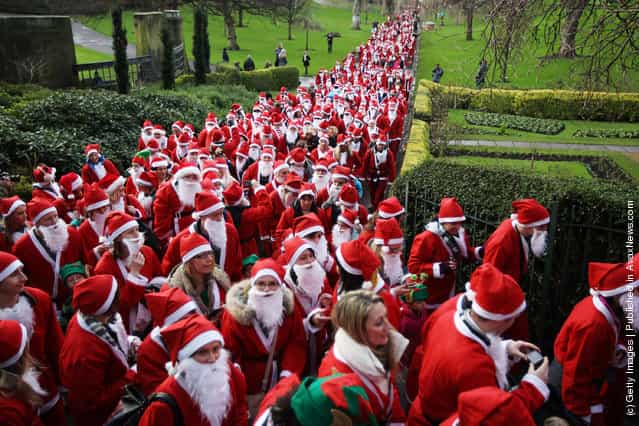 Participants dressed as Santa Claus take part in the Great Edinburgh Santa Run on December 11, 2011 in Edinburgh, Scotland