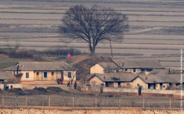 The North Korean village of Gaepung-Gun and its inhabitants are seen from a South Korean observation post