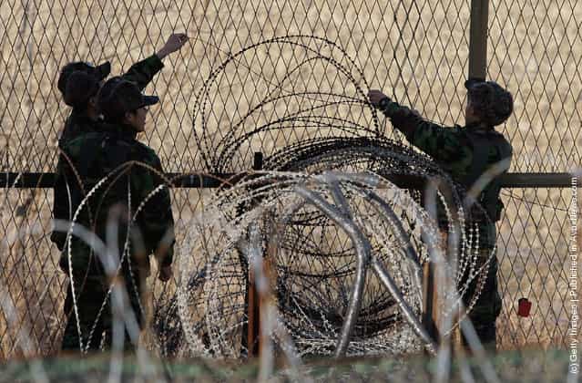 South Korean soldier check the barbed-wire fence at Imjinkak, near the Demilitarized zone (DMZ) separating South and North Korea