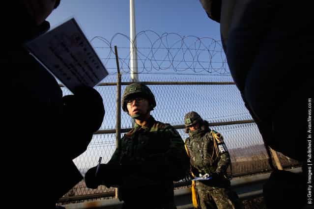South Korean soldiers walk along barricades at the military check point, near the Demilitarized zone (DMZ) separating South and North Korea
