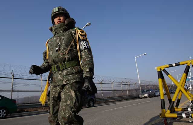 South Korean soldiers walk along barricades at the military check point, near the Demilitarized zone (DMZ) separating South and North Korea