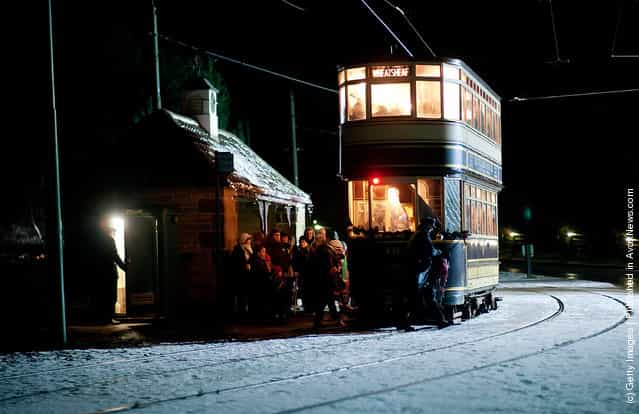 Visitors queue to board a tram at Beamish, the living museum of the North, on December in Birtley, Tyne and Wear