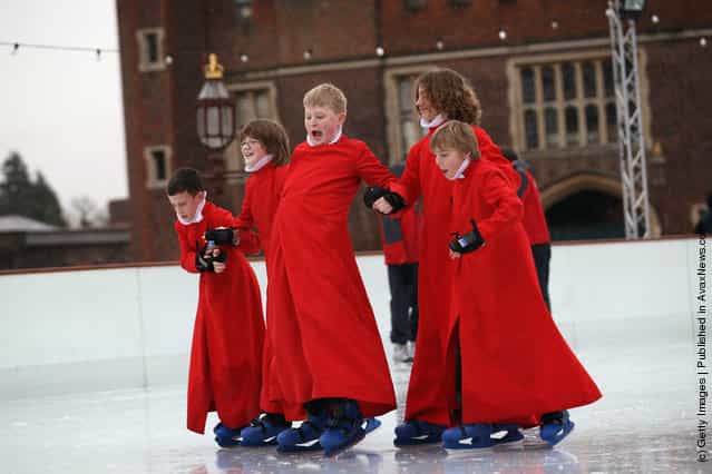 Members of Chapel Royal Choirboys choir attempt to skate during a photocall at the Hampton Court Ice Rink on December in London