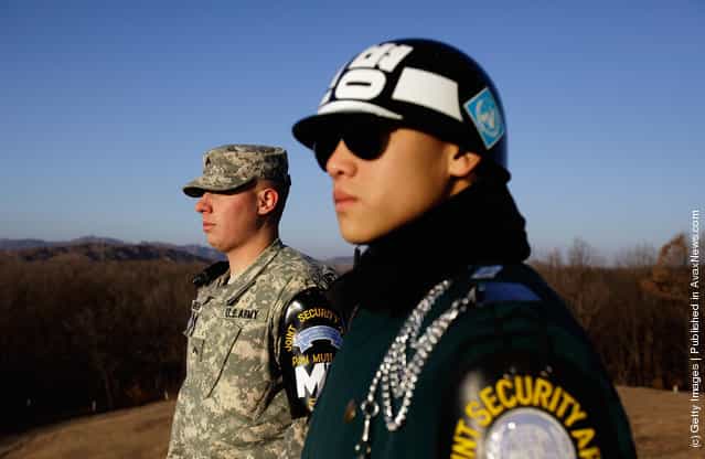 U.S. and South Korean soldiers stand guard at the border village of Panmunjom