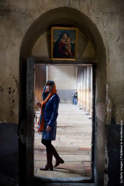 A Christian pilgrim walks through the Church of the Nativity in Bethlehem