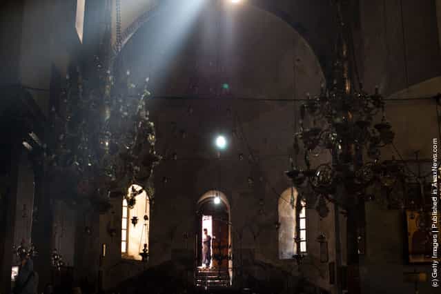 A priest makes his way out of the Church of the Nativity on December 22, 2011 in Bethlehem, West Bank