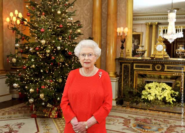 Queen Elizabeth II stands in the 1844 Room of Buckingham Palace after recording her annual Christmas Day television broadcast to the Commonwealth