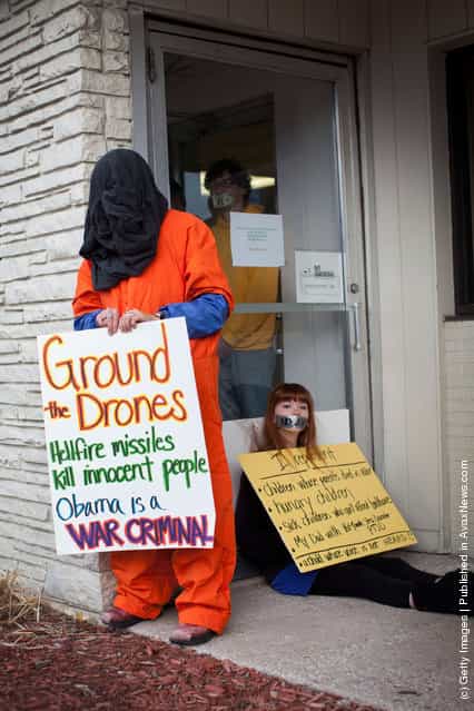 Protestors affiliated with the Occupy Wall Street movement block the entrance to the Iowa Democratic Party headquarters during a protest on December 29, 2011 in Des Moines, Iowa. Thirteen people were arrested during the protest