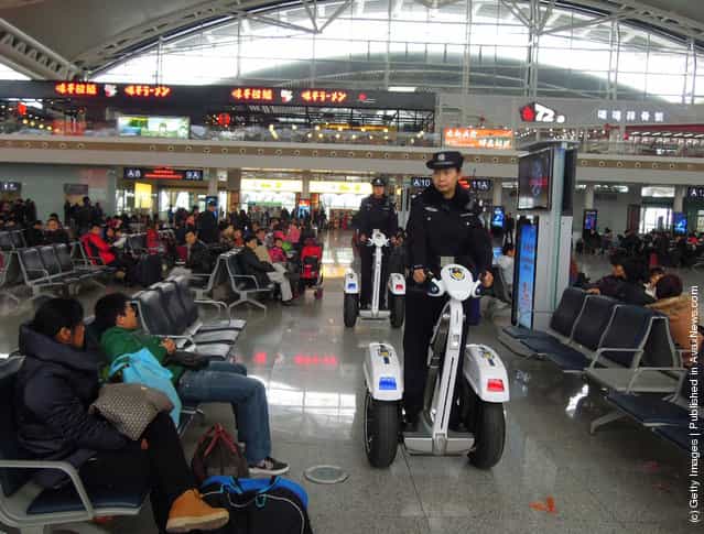 Police women ride Segways as they patrol at Guangzhou South Railway Station in Guangzhou, China