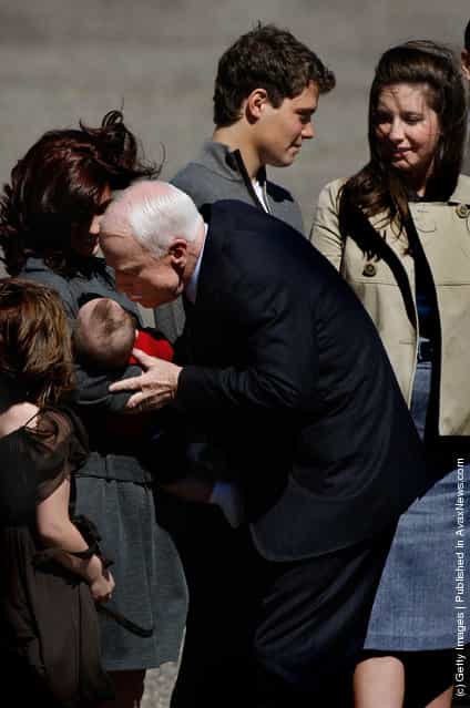 Presumptive Republican presidential nominee John McCain bends to kiss 5-month-old Trig Palin, son of vice presidential candidate and Alaska Gov. Sarah Palin