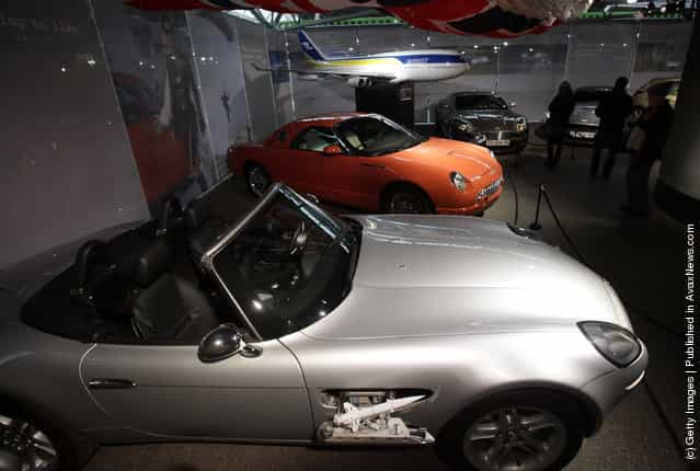 People look at cars including a BMW Z8 that was used in the James Bond film The World Is Not Enough currently displayed at the Bond In Motion exhibition