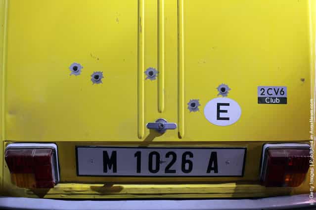 Bullet hole stickers on the rear of a Citroen 2CV6 that was used in the 1981 James Bond film For Your Eyes Only and is currently being displayed at the Bond In Motion exhibition