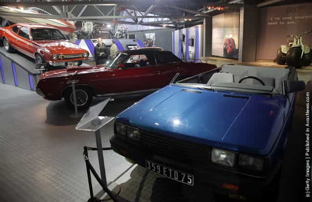 People look at cars, including a roofless Renault 11 TXE that was used in the 1985 James Bond film A View To a Kill, currently displayed at the Bond In Motion exhibition