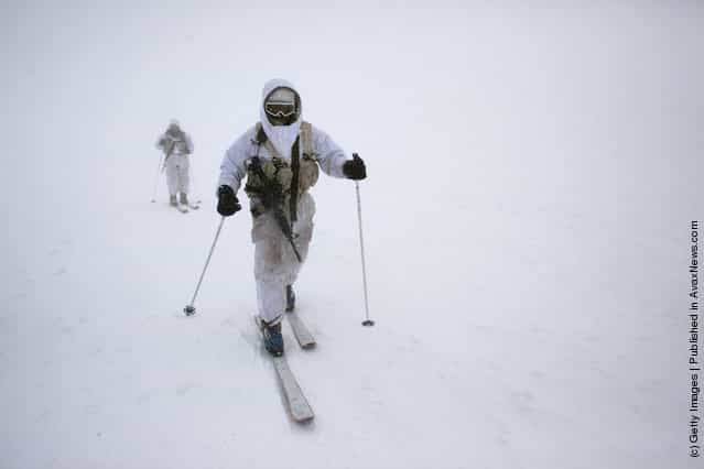 Israeli army alpine soldiers ski near their outpost during an exercise