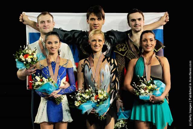 (L-R) Vera Bazarova and Yuri Larionov (silver) of Russia, Tatiana Volosazhar and Maxim Trankov (gold) of Russia and Ksenia Stolbova and Fedor Klimov of Russia (bronze) celebrate on the podium with their medals after the Pairs Free Skating during the ISU European Figure Skating Championships at Motorpoint Arena