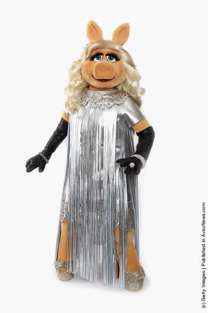 Miss Piggy debuts her dress designed by Giles Deacon for the UK premiere of The Muppets this evening at The Mayfair Hotel