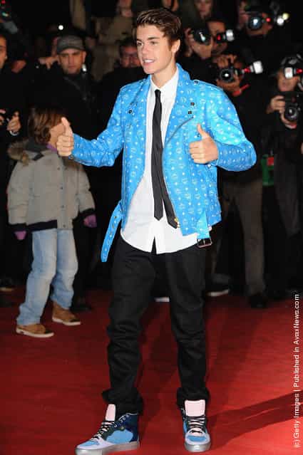 Justin Bieber poses as he arrives at NRJ Music Awards 2012 at Palais des Festivals