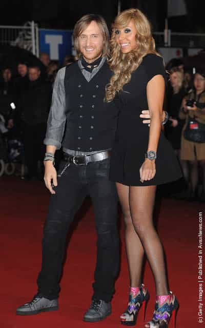 David and Cathy Guetta pose as they arrive at NRJ Music Awards 2012 at Palais des Festivals