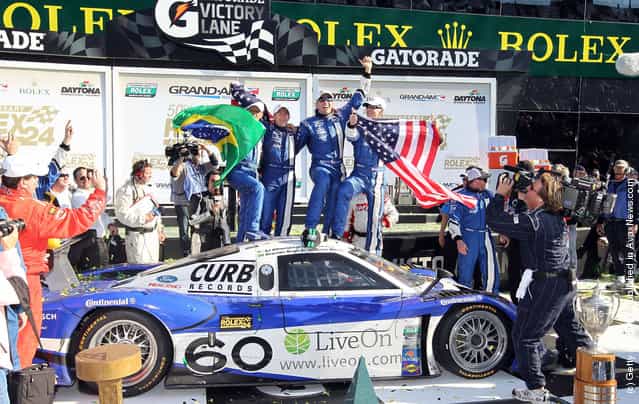 Drivers of the #60 Michael Shank Racing with Curb-Agajanian - Ford Riley celebrate after winning the Rolex 24 at Daytona International Speedway