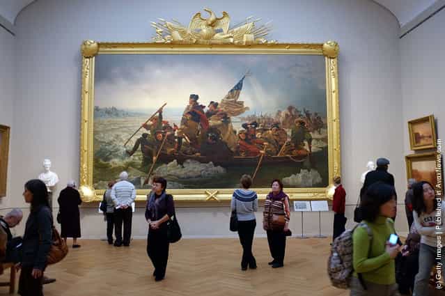 People visit the new American Wing for paintings, sculpture and decorative arts at the Metropolitan Museum of Art