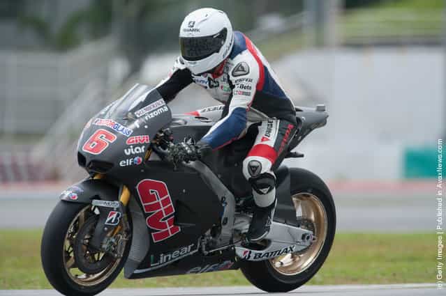 Stefan Bradl of Germany and LCR Honda MotoGP heads down a straight during the first day of MotoGP testing at Sepang Circuit