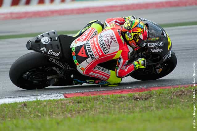 Valentino Rossi of Italy and and Ducati Marlboro Team rounds the bend during the third day of MotoGP testing at Sepang Circuit