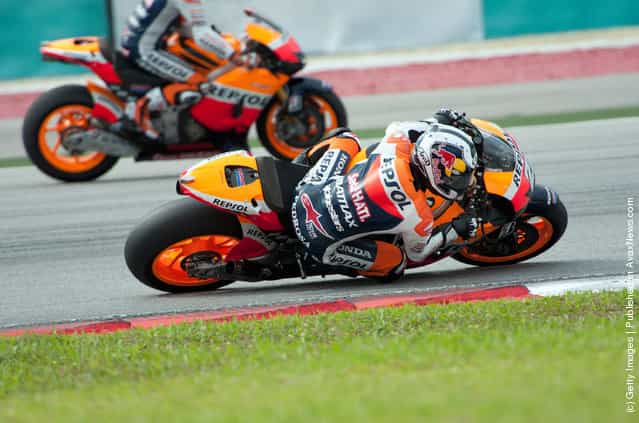 Dani Pedrosa of Spain and Repsol Honda Team rounds the bend during the third day of MotoGP testing at Sepang Circuit