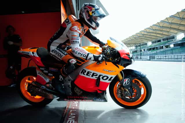 Dani Pedrosa of Spain and Repsol Honda Team starts from box during the third day of MotoGP testing at Sepang Circuit
