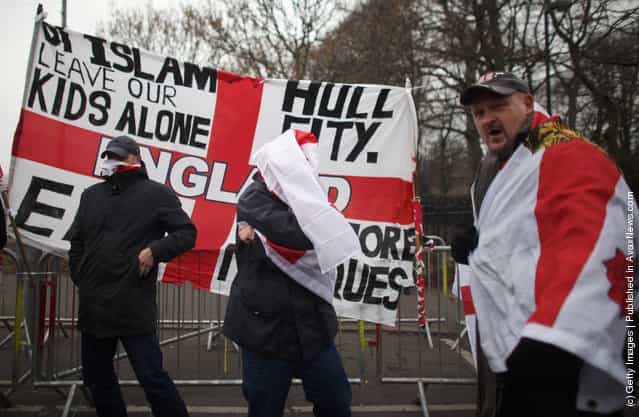 Members of the English Defence League (EDL) take part in a demonstration through the streets of Leicester