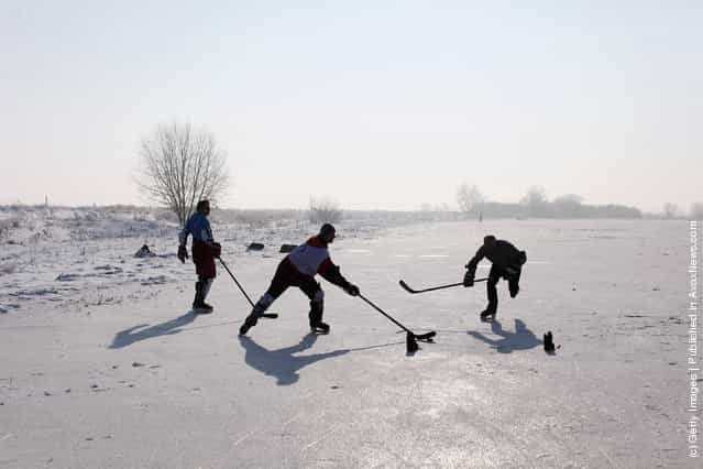 Enthusiasts skate on a frozen fen in sub-zero temperatures